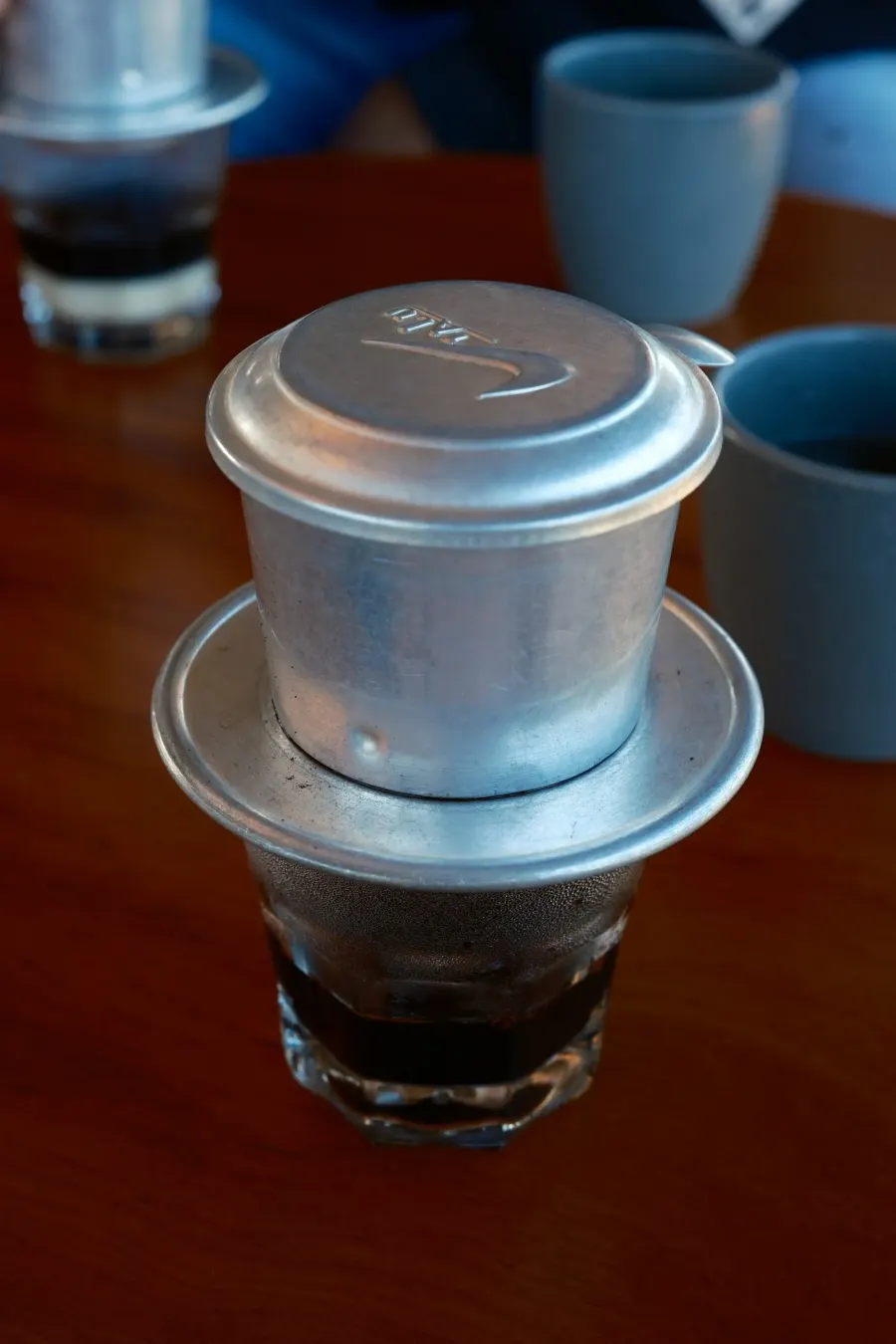 Vietnamese coffee brewing in a phin filter